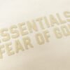 FEAR OF GOD ESSENTIALS MID-LOGO LIGHT APRICOT HOODIE